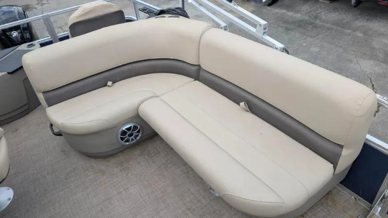 Slide: The Image of 2024 Sun Tracker Bass Buggy 18 DLX pontoon boat seating, beige and gray upholstery. - 9