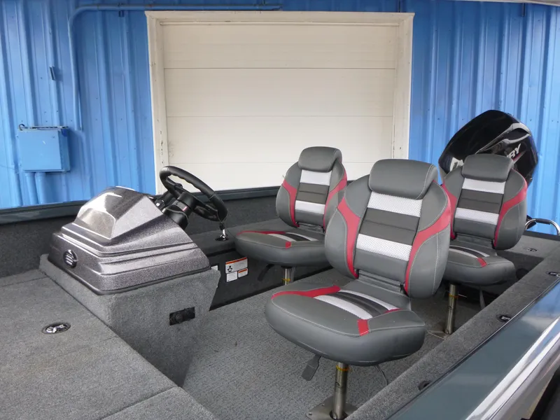 Slide: The Image of 2024 Ranger VS1665SC boat interior with modern seating and steering console. - 3