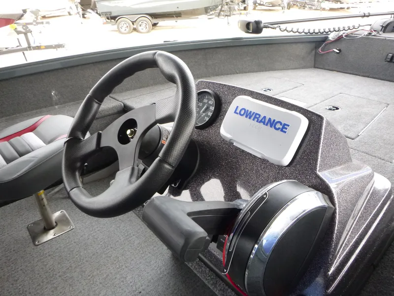 Slide: The Image of 2024 Ranger VS1665SC boat dashboard with steering wheel and Lowrance display. - 4