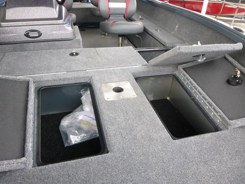 Slide: The Image of 2024 Ranger VS1665SC boat interior with storage compartments and seating. - 6