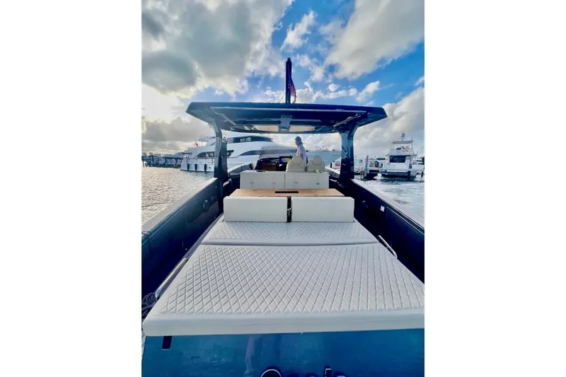 Slide: The Image of 2022 Tesoro T40 Inboard yacht with spacious deck, docked at marina under cloudy sky. - 11
