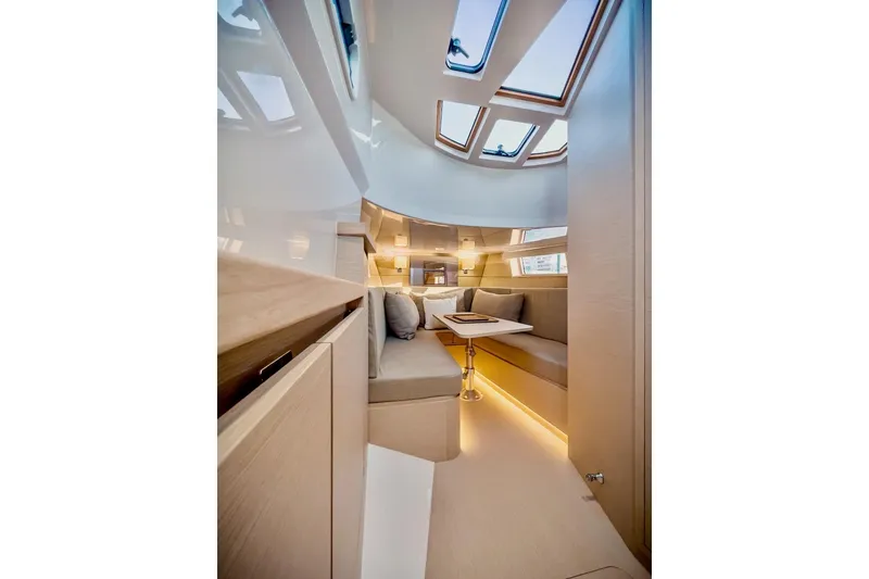 Slide: The Image of 2022 Tesoro T40 Inboard yacht interior with modern seating and skylights. - 14
