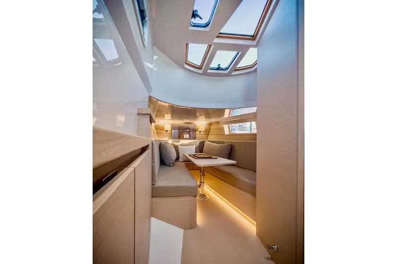 Slide: The Image of Luxurious interior of 2022 Tesoro T40 Inboard yacht with modern seating and skylights. - 15