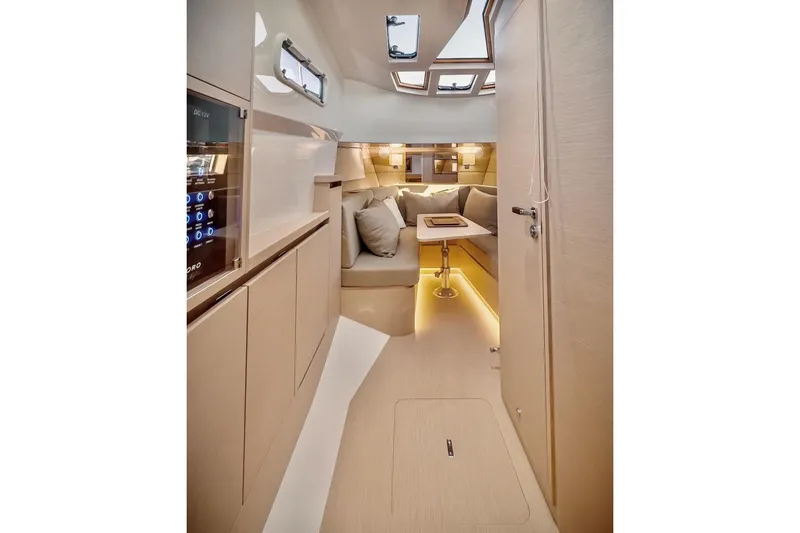 Slide: The Image of Luxurious interior of 2022 Tesoro T40 Inboard yacht with modern seating and ambient lighting. - 19