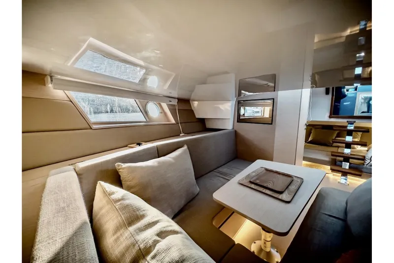 Slide: The Image of Luxurious interior of 2022 Tesoro T40 Inboard yacht with modern seating and table. - 20
