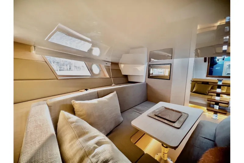 Slide: The Image of Luxurious interior of 2022 Tesoro T40 Inboard yacht with modern seating and table. - 21