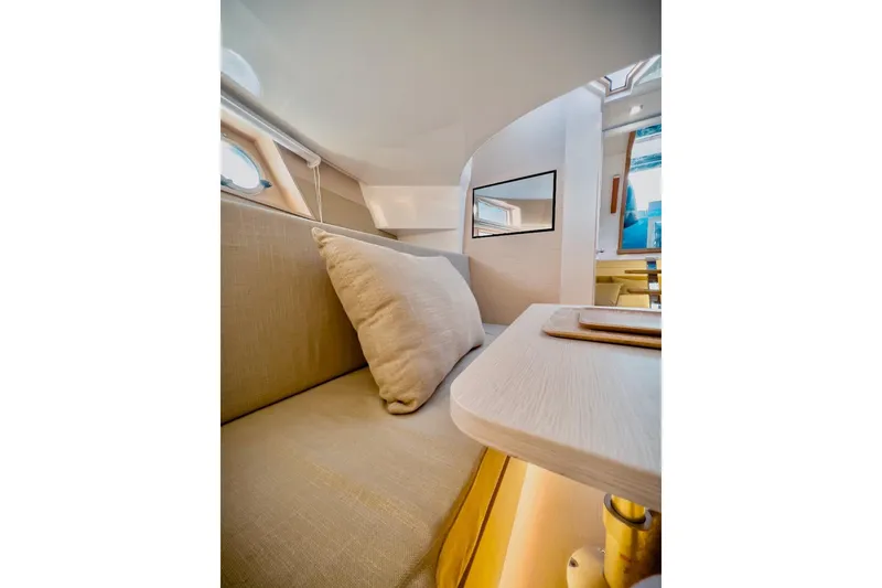 Slide: The Image of 2022 Tesoro T40 Inboard interior with beige seating and modern design. - 27