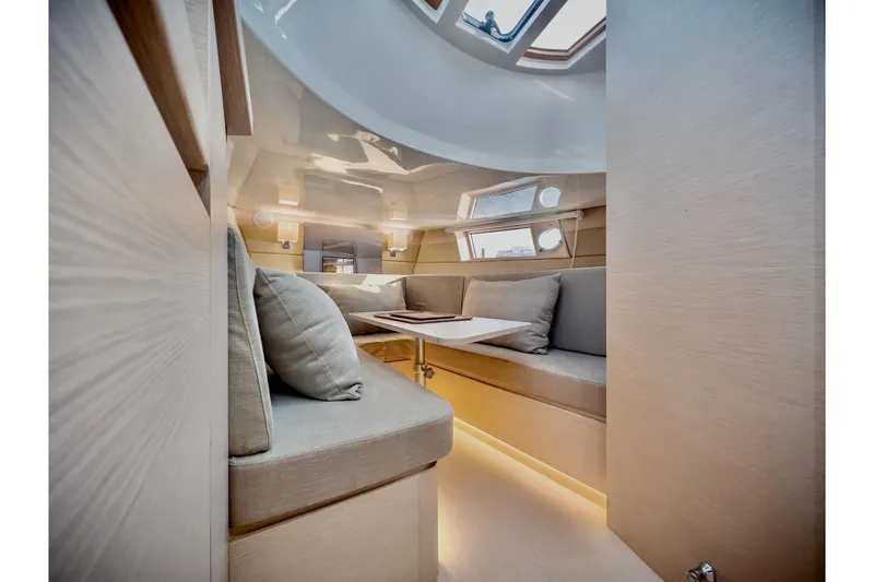 Slide: The Image of Luxurious interior of 2022 Tesoro T40 Inboard yacht with modern seating and ambient lighting. - 31