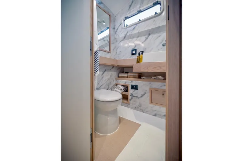 Slide: The Image of 2022 Tesoro T40 Inboard yacht bathroom with modern design and marble accents. - 35
