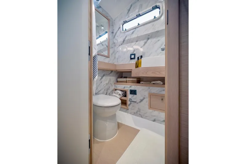 Slide: The Image of Luxurious bathroom in 2022 Tesoro T40 Inboard yacht with marble walls and modern fixtures. - 36
