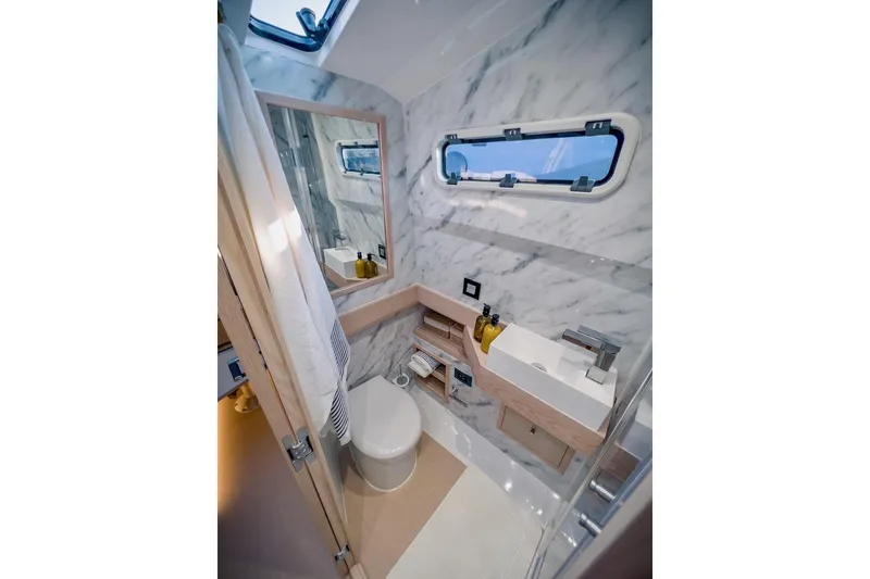 Slide: The Image of Luxurious bathroom in 2022 Tesoro T40 Inboard yacht with marble walls and modern fixtures. - 37