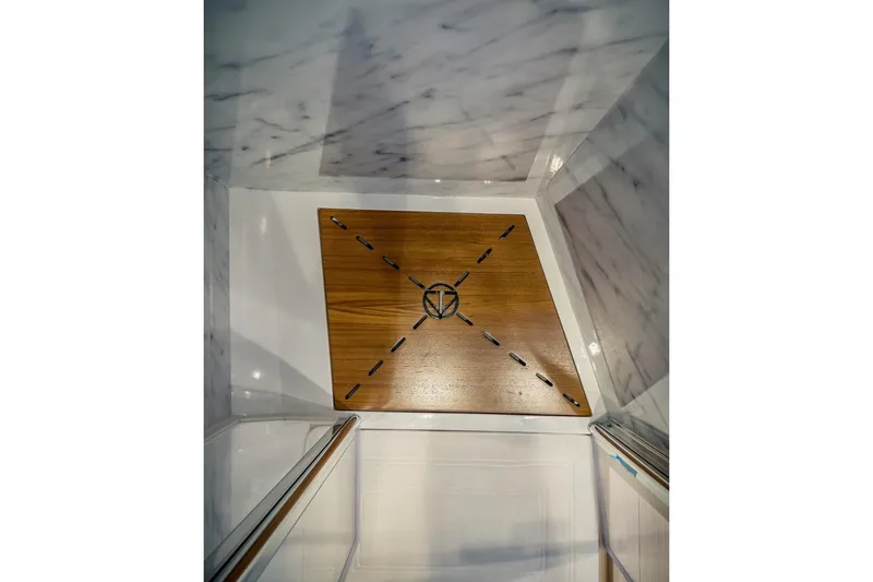 Slide: The Image of 2022 Tesoro T40 Inboard interior with wooden and marble design elements. - 40
