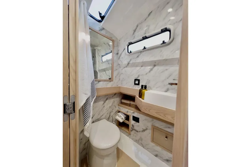 Slide: The Image of Luxurious bathroom in 2022 Tesoro T40 Inboard yacht with marble walls and modern fixtures. - 42