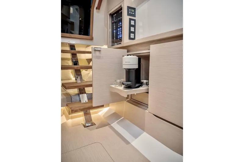 Slide: The Image of 2022 Tesoro T40 Inboard yacht interior with modern cabinetry and built-in coffee maker. - 45
