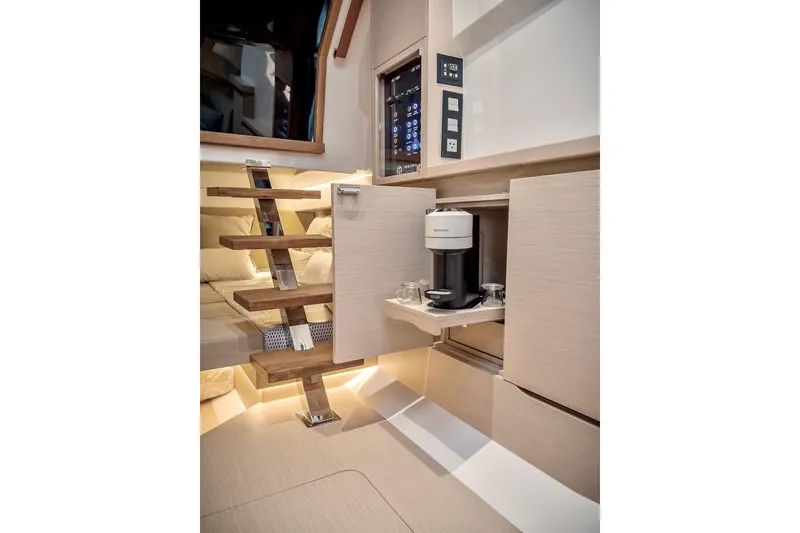 Slide: The Image of 2022 Tesoro T40 Inboard yacht interior with modern staircase and built-in coffee maker. - 46