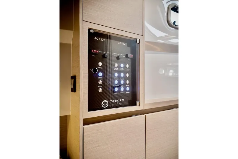 Slide: The Image of Control panel of 2022 Tesoro T40 Inboard boat, featuring AC and DC switches. - 47