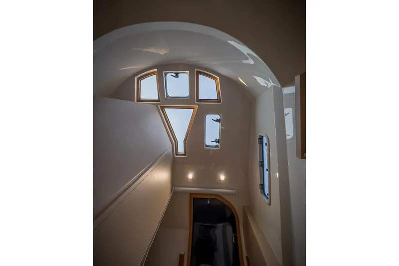 Slide: The Image of Interior view of 2022 Tesoro T40 Inboard yacht, featuring modern windows and sleek design. - 49