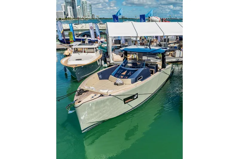 Slide: The Image of 2022 Tesoro T40 Inboard yacht docked at marina, showcasing sleek design and modern features. - 6