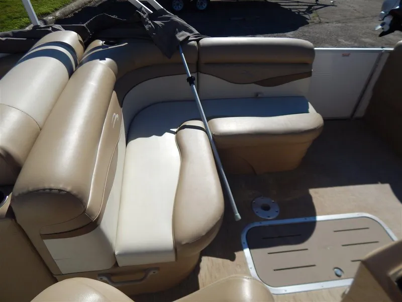 Slide: The Image of 2016 Bennington 24 SSLX boat interior with beige seating and floor. - 7