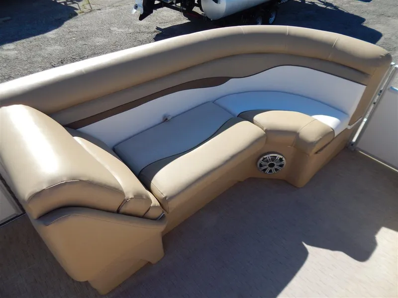 Slide: The Image of 2016 Bennington 24 SSLX pontoon boat seating, beige and white upholstery, outdoor setting. - 9
