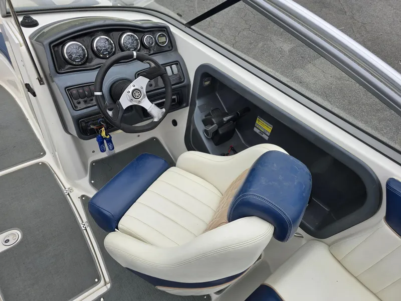Slide: The Image of 2009 Yamaha Boats AR230 HO cockpit with steering wheel and gauges. - 11
