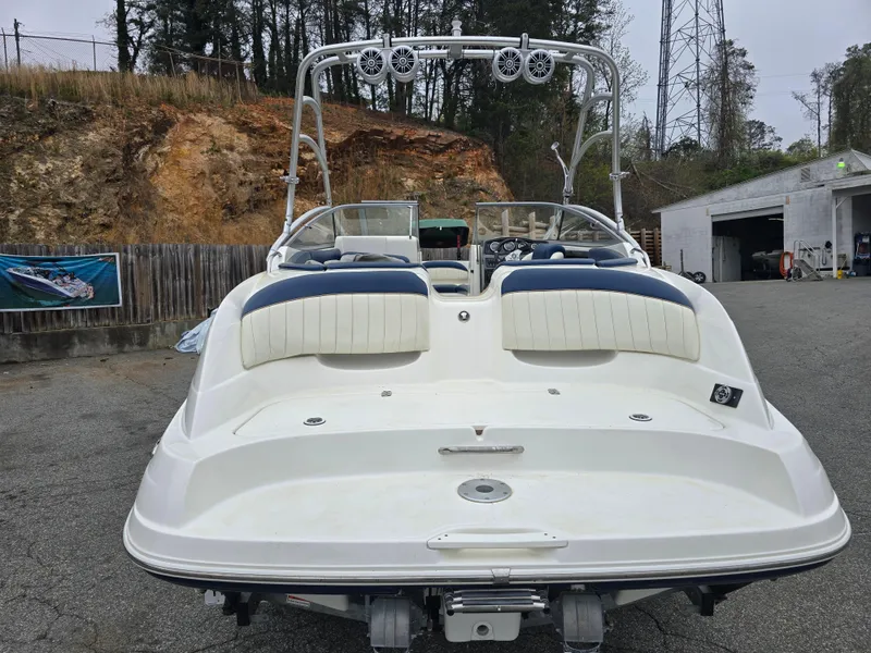Slide: The Image of 2009 Yamaha Boats AR230 HO, rear view, parked outdoors near a garage. - 3