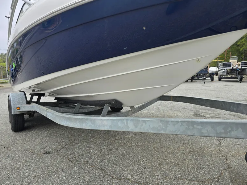 Slide: The Image of 2009 Yamaha Boats AR230 HO on trailer, showcasing sleek hull design. - 7