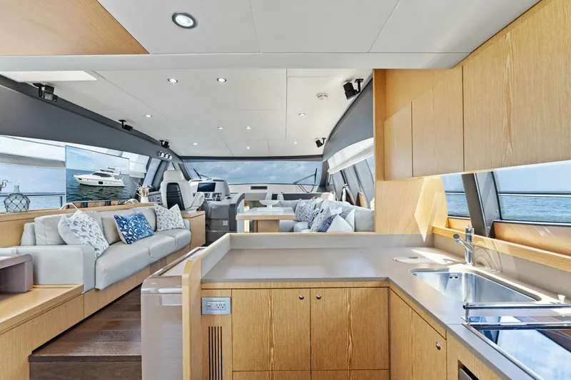 Slide: The Image of Luxurious interior of 2013 Ferretti Yachts 620 with modern kitchen and seating area. - 12