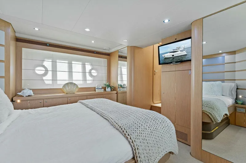 Slide: The Image of Luxurious bedroom interior of 2013 Ferretti Yachts 620, featuring elegant decor and modern amenities. - 24