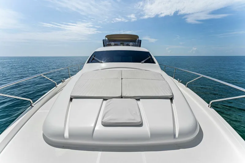 Slide: The Image of Ferretti Yachts 620, 2013 model, cruising on open sea under clear blue sky. - 3