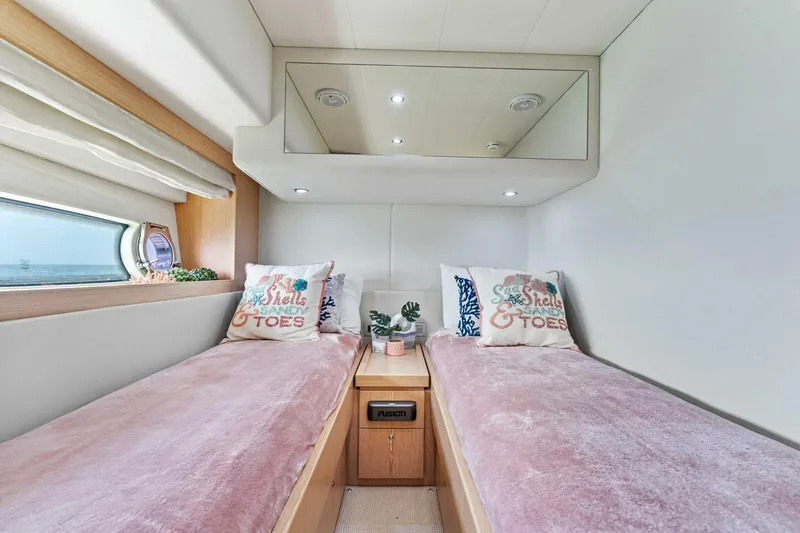 Slide: The Image of Luxurious twin cabin in 2013 Ferretti Yachts 620 with plush bedding and modern decor. - 36