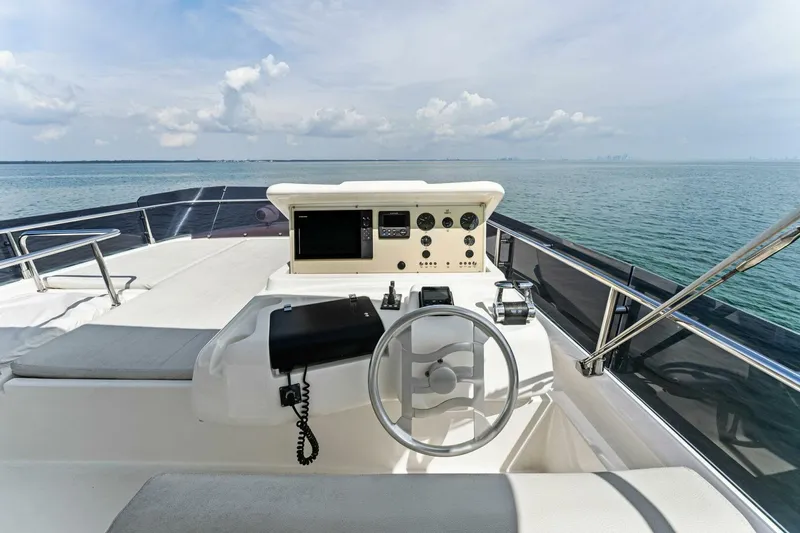 Slide: The Image of Flybridge of 2013 Ferretti Yachts 620 with ocean view and navigation controls. - 46