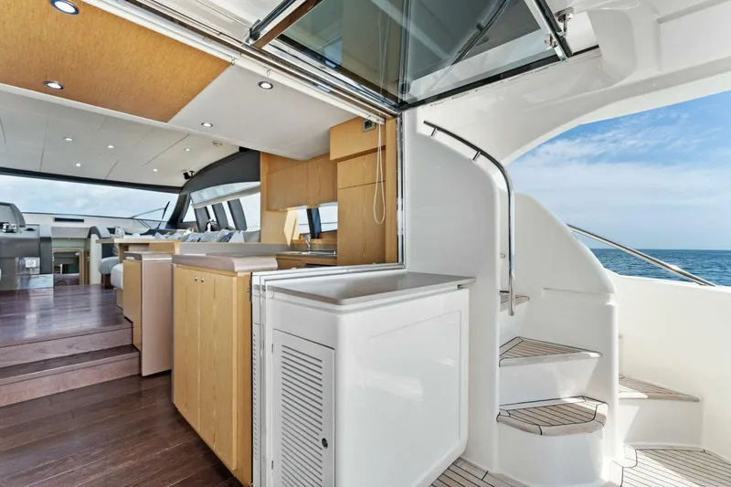 Slide: The Image of Luxurious interior of 2013 Ferretti Yachts 620 with modern kitchen and ocean view. - 11