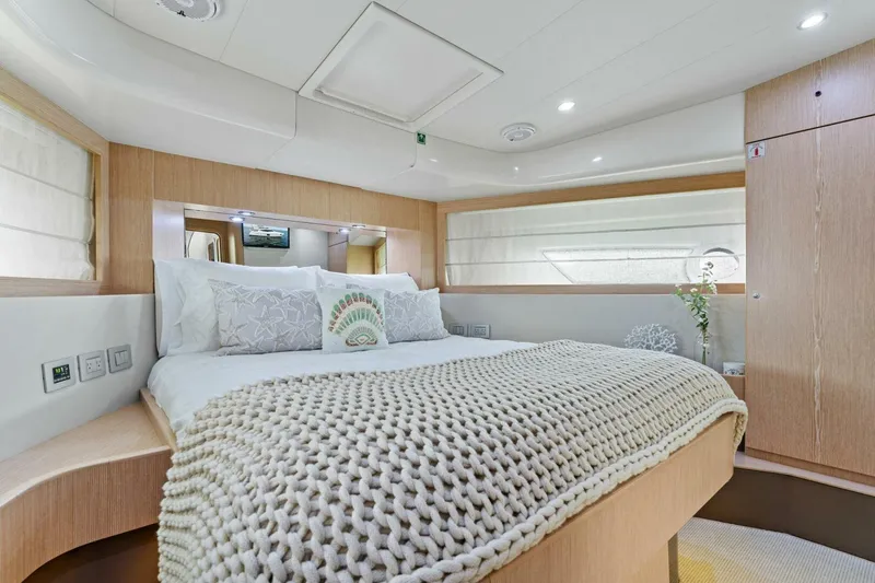 Slide: The Image of Luxurious bedroom interior of 2013 Ferretti Yachts 620 with cozy bedding and modern design. - 32