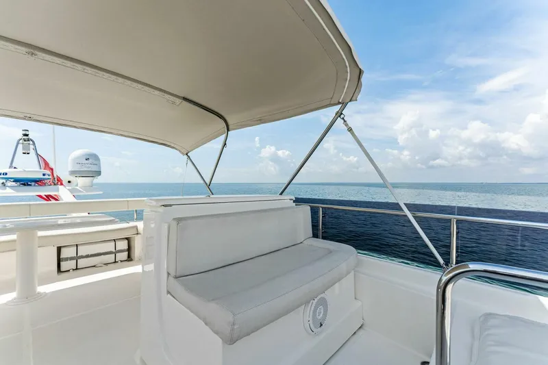 Slide: The Image of Luxurious 2013 Ferretti Yachts 620 with shaded seating, overlooking serene ocean views. - 48