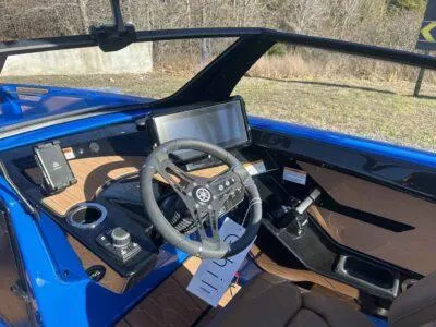 Slide: The Image of 2025 Yamaha Boats 222XE cockpit with modern steering and controls, featuring sleek design elements. - 6