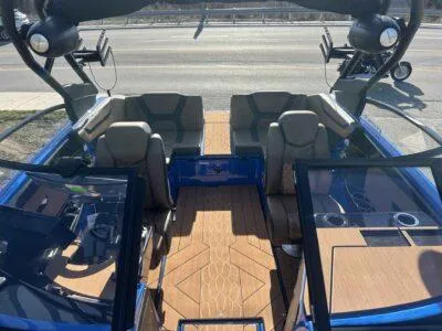 Slide: The Image of 2025 Yamaha Boats 222XE interior with modern seating and sleek design. - 9