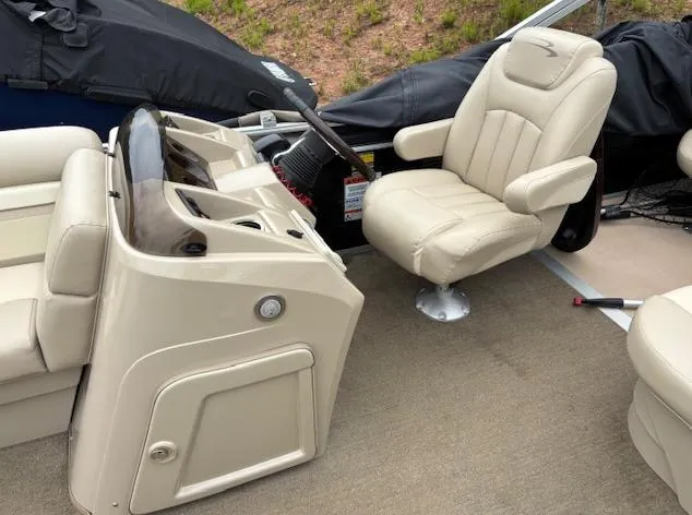 Slide: The Image of 2014 Bennington 22 SSX boat interior with beige captain's chair and console. - 4