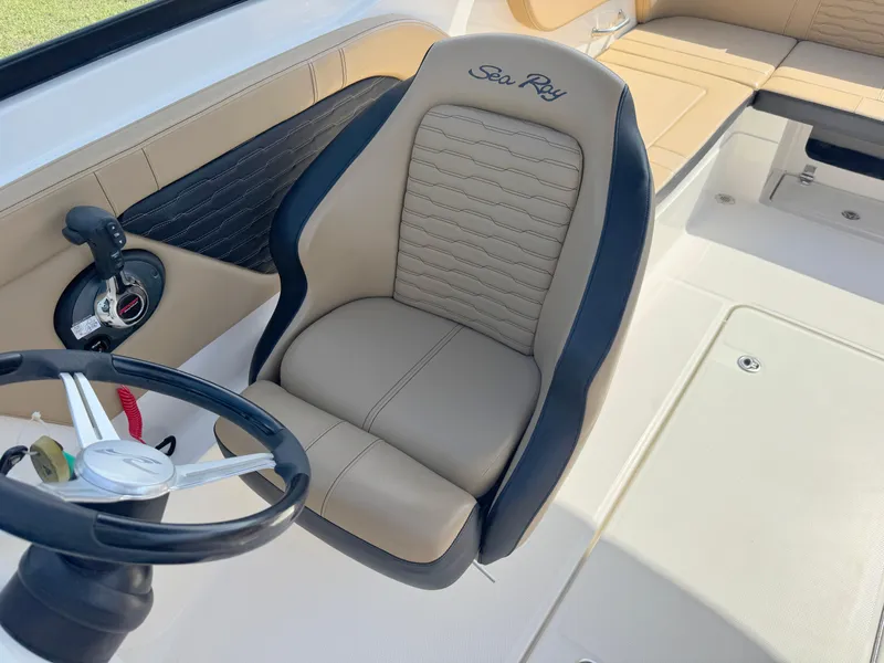 Slide: The Image of Captain's seat and steering wheel of 2022 Sea Ray SPX 230 OB boat. - 13