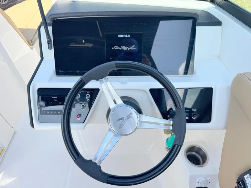 Slide: The Image of Steering wheel and dashboard of 2022 Sea Ray SPX 230 OB boat. - 16