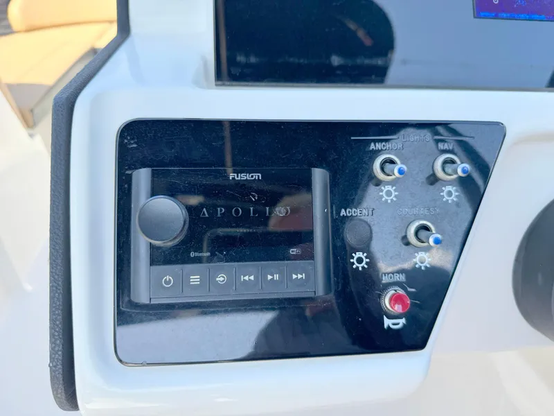 Slide: The Image of Control panel of 2022 Sea Ray SPX 230 OB with Fusion Apollo audio system. - 17