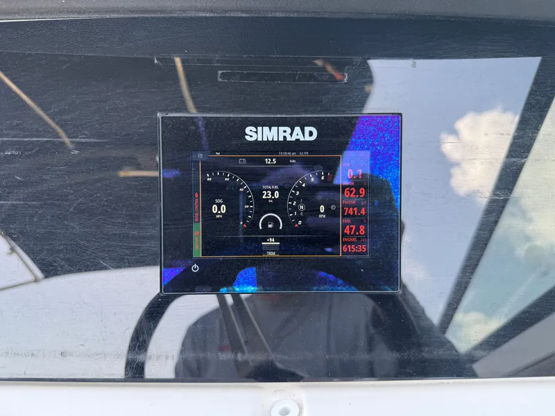 Slide: The Image of Simrad display on 2022 Sea Ray SPX 230 OB showing speed and engine data. - 18