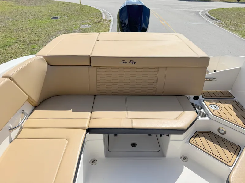 Slide: The Image of 2022 Sea Ray SPX 230 OB boat with tan seating and modern design. - 23