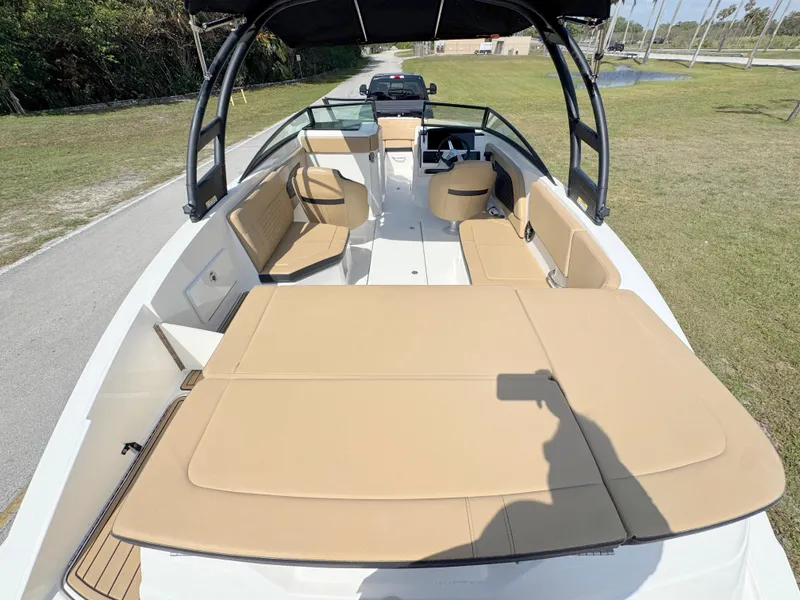 Slide: The Image of 2022 Sea Ray SPX 230 OB boat with spacious seating and sleek design. - 28