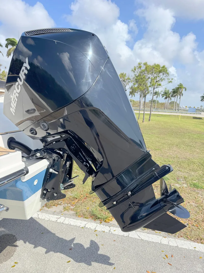 Slide: The Image of 2022 Sea Ray SPX 230 OB with Mercury outboard engine, parked outdoors. - 32