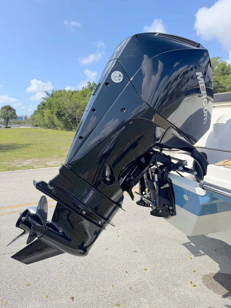 Slide: The Image of 2022 Sea Ray SPX 230 OB with Mercury outboard engine, parked outdoors. - 33