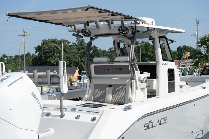 Slide: The Image of 2025 Solace 32 CS boat with canopy, featuring sleek design and modern amenities. - 17