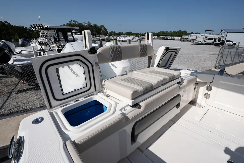 Slide: The Image of 2026 Solace 32 CS boat interior with seating and storage compartments. - 21