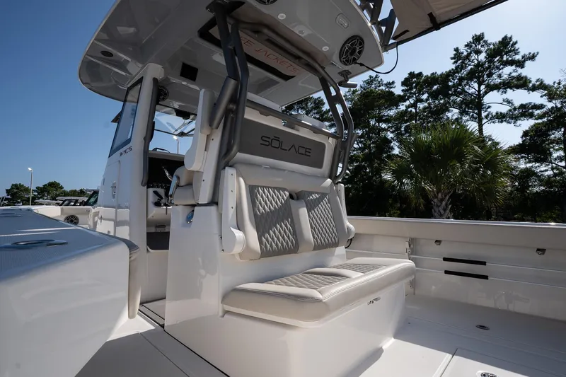 Slide: The Image of 2026 Solace 32 CS boat interior with cushioned seating and modern design. - 24