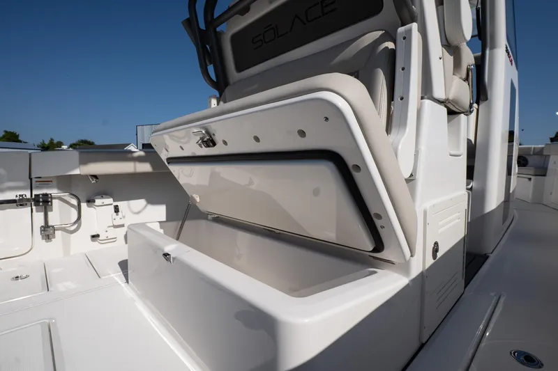 Slide: The Image of 2026 Solace 32 CS boat interior with open storage compartment. - 25